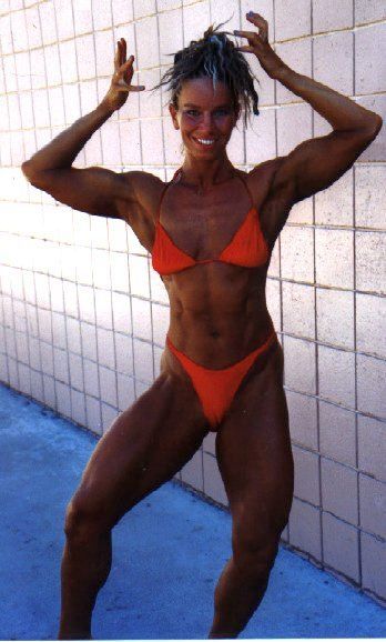 Suzanna's past bodybuilding times, double biceps pose