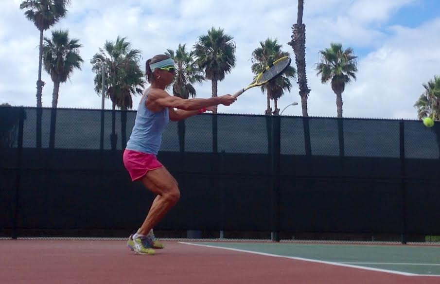 Suzanna McGee hitting a powerful forehand… learn how to improve tennis swing power