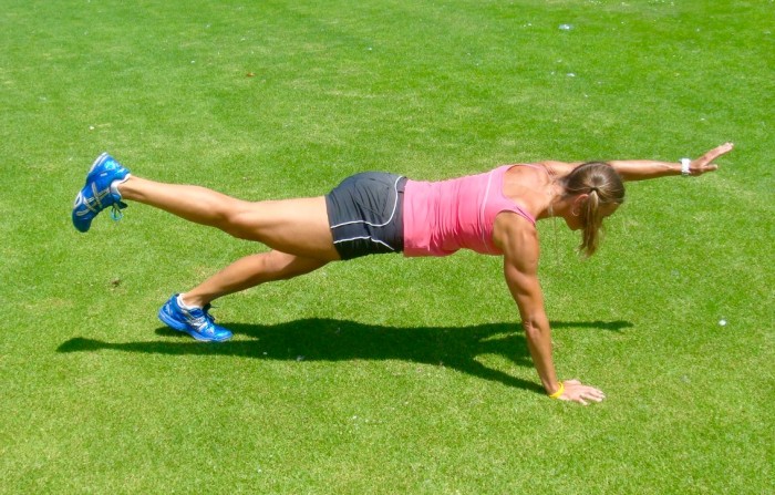 strong core with a plank with arm and leg lift